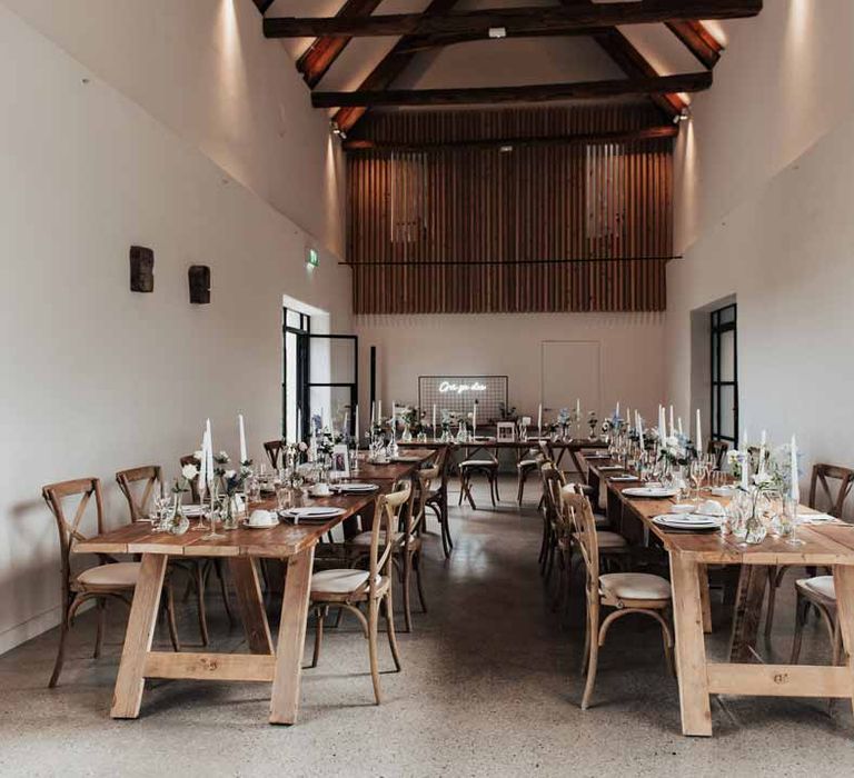 Reception room of Brickhouse Vineyard Devon wedding venue with modern rustic wedding tablescape 