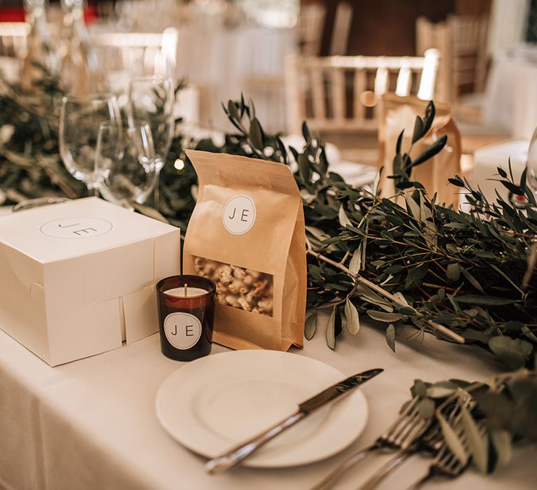 Personalised bag of popcorn, box of doughnuts and wedding candle for the wedding favours 