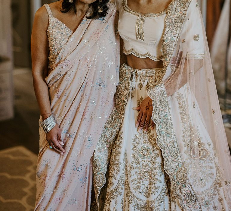 Mother of the bride standing with the bride on the morning of the wedding 