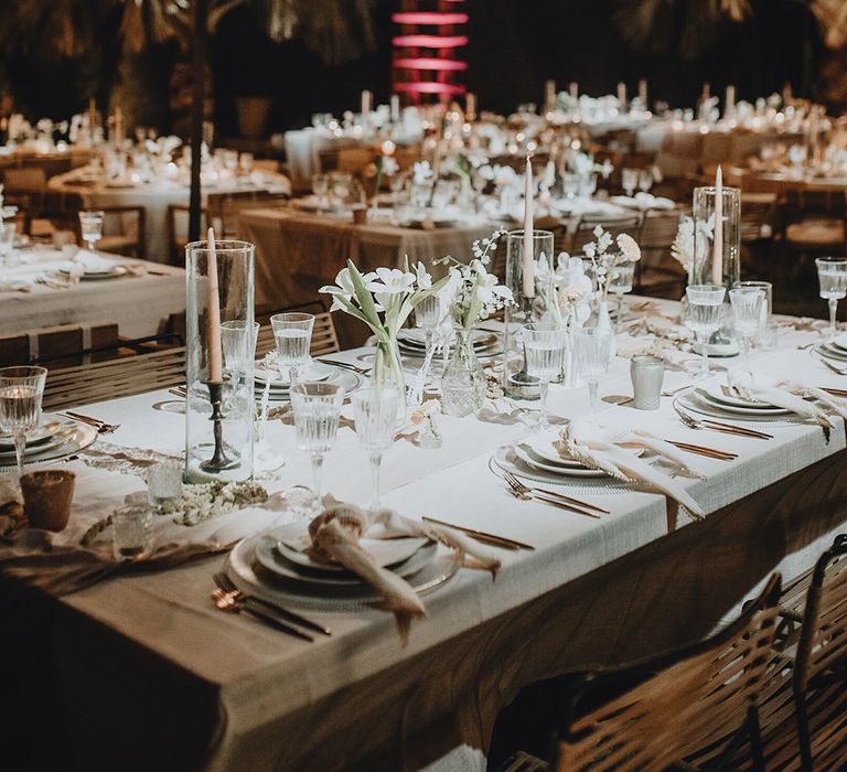 White wedding tablescapes and tassel lampshades at Tigre Del Mar wedding reception