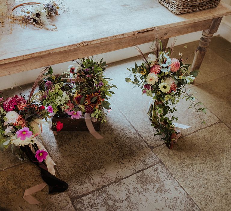 British-grown seasonal pink wedding flowers in bouquets for the brides 