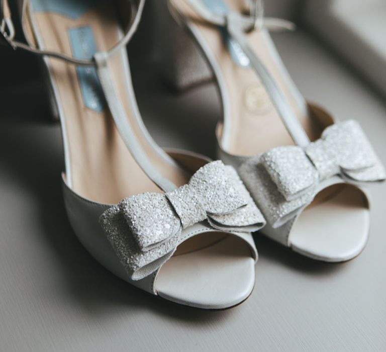 Charlotte Mills white glitter wedding shoes with bow detail 