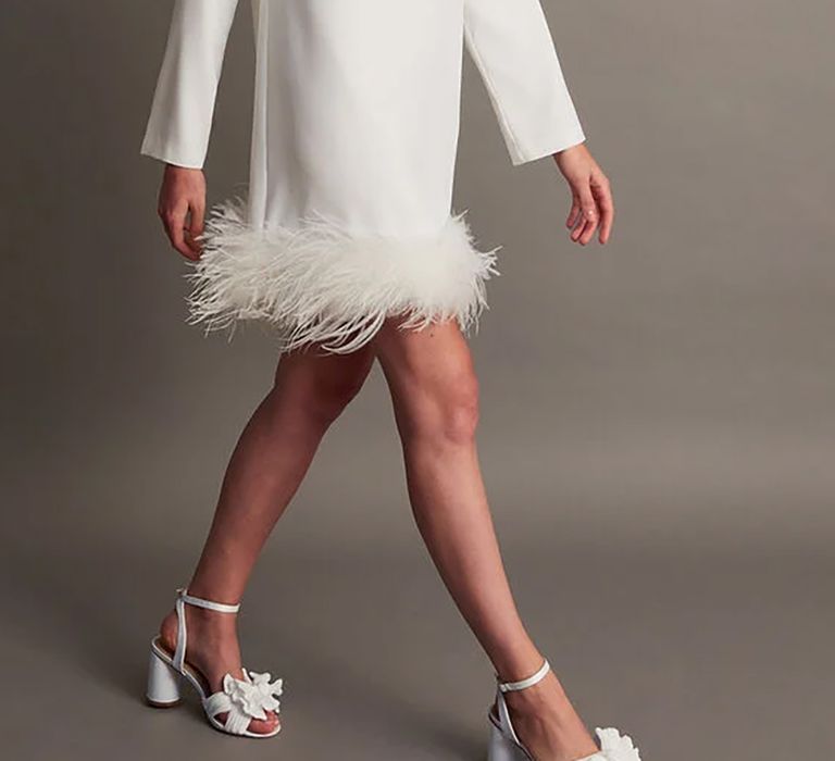 Mini Monsoon wedding dress with feather trim