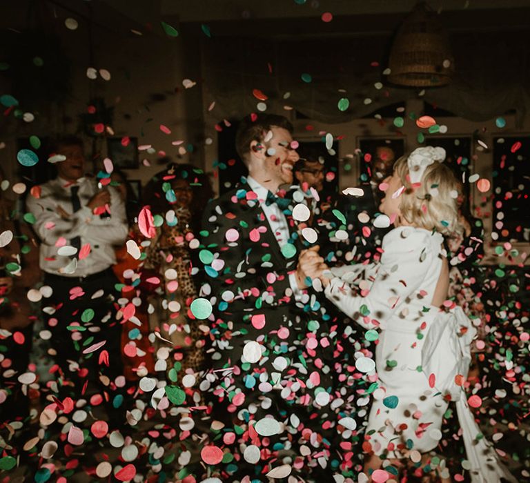 Colourful pastel confetti exit for the bride and groom 