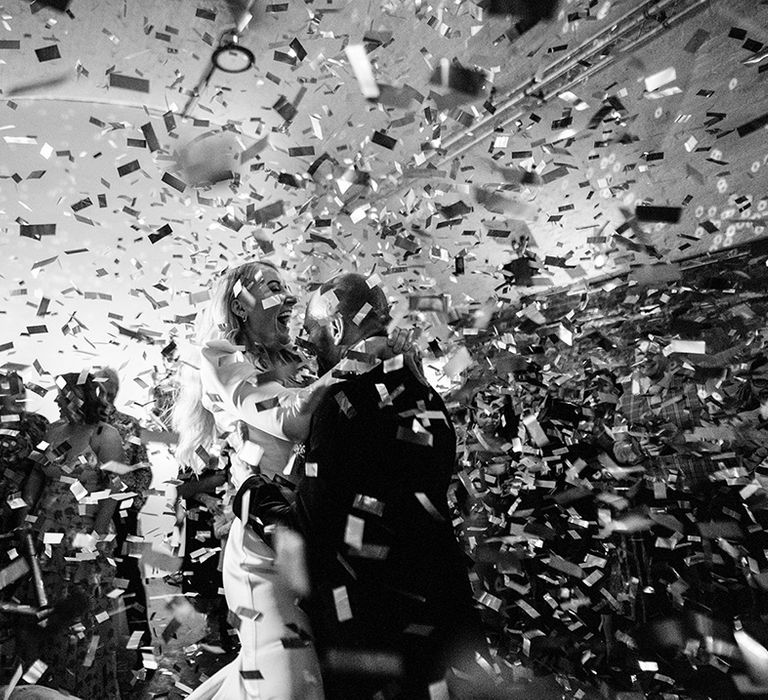 Epic confetti canon explosion during the first dance for the bride and groom 