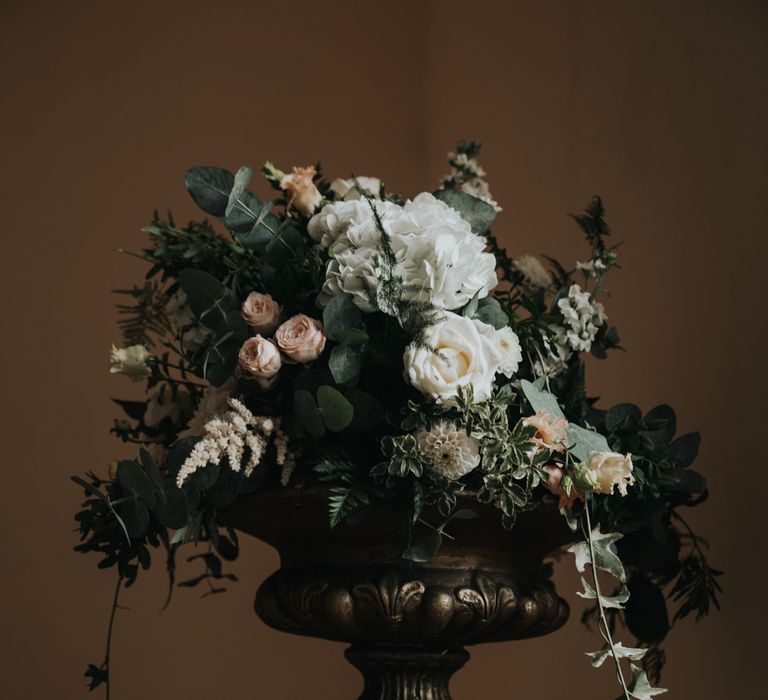 Floral arrangement on gold stand