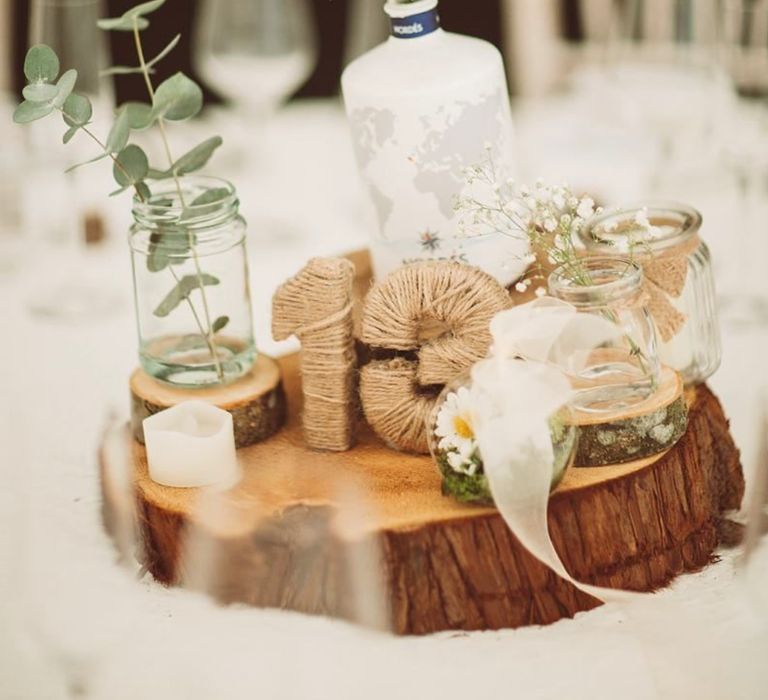 DIY wedding centrepiece with gin bottles