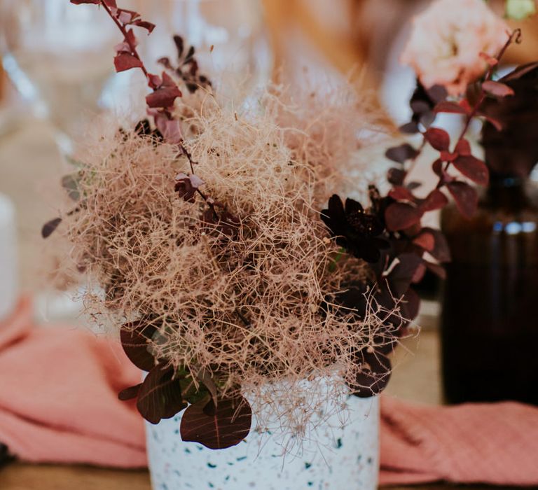 Potted plant in deep red and orange shades 