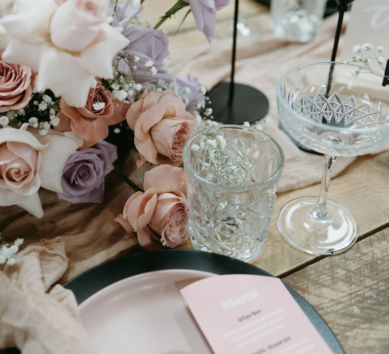 pink and purple wedding decor ideas including taper candles, and pastel flowers 