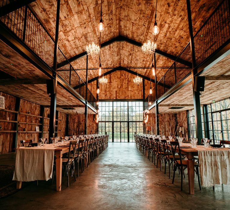 Neutral wedding theme reception at The Hidden River Cabins with festoon lights 