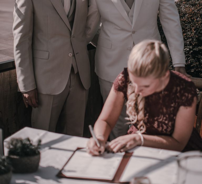 Grooms in light grey wedding suit