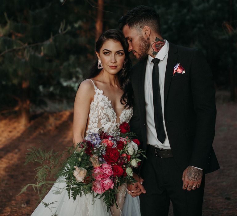 Bride and groom in the woods for their South African moody romantic wedding