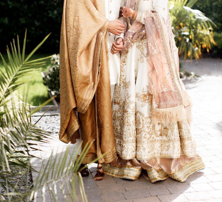 Couple wear traditional Pakistani dress for Nikah ceremony. 