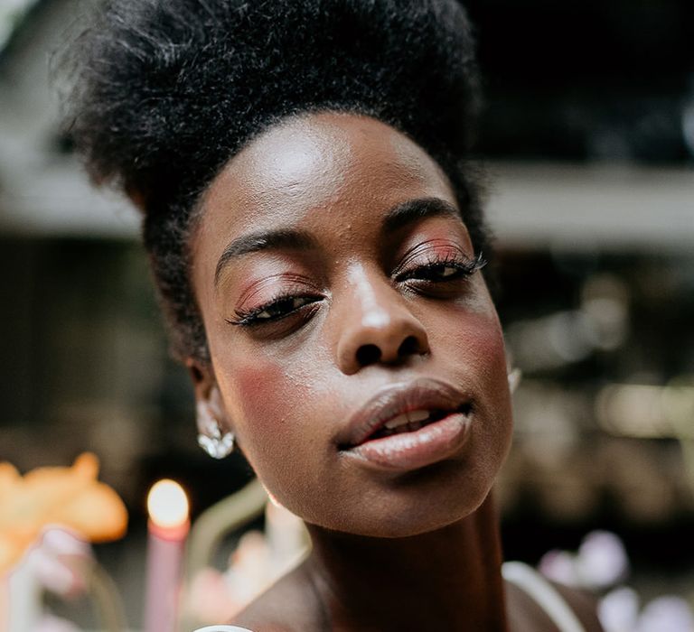 Black bride wedding makeup with long eyelashes 