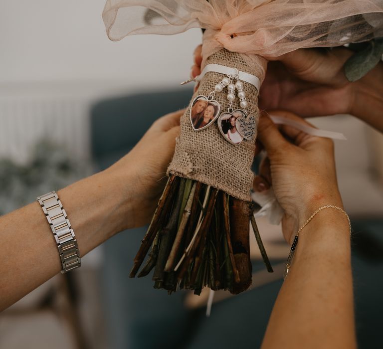 Bridal bouquet complete with white ribbon and personalised charms dangling from ribbon | Mark Bamforth Photography