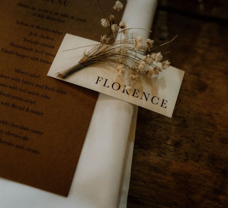 Minimalistic wedding place names with dried florals for rustic wedding reception 