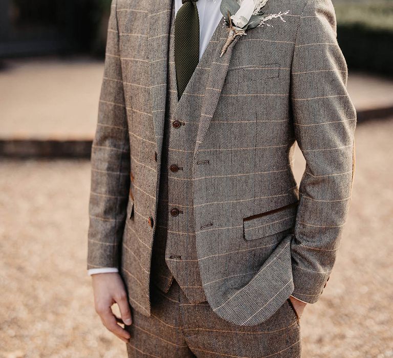 Groom in tweed check suit