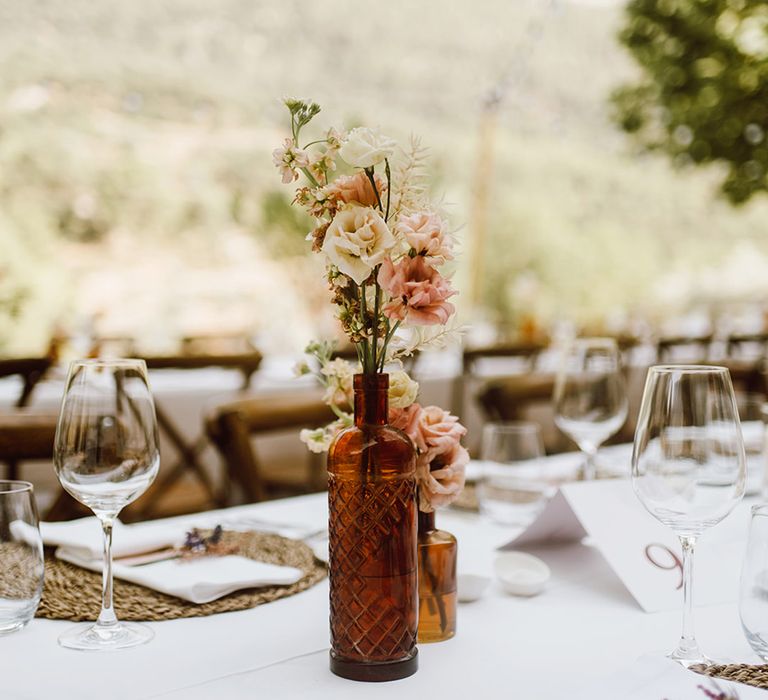 Minimal pink and white flower centrepieces for the tables