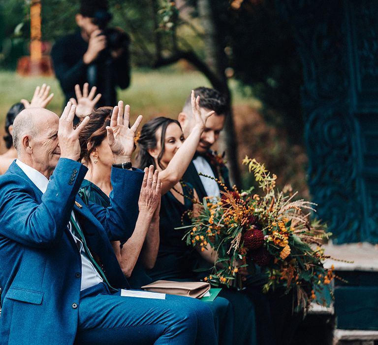 Wedding guests participate in sign language wedding ceremony at Askham Hall 