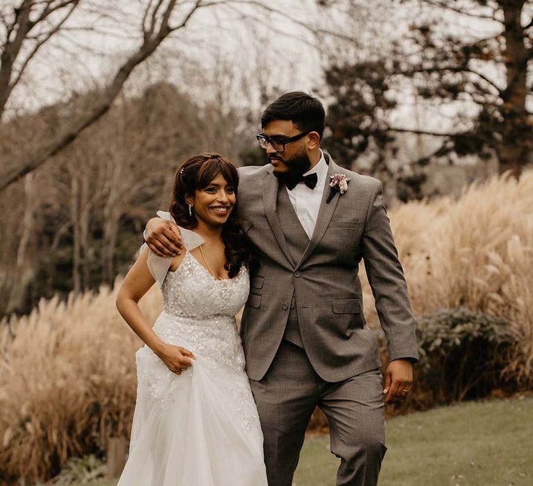 Bride (before mint green saree change) and groom walking around the grounds of The Petersham Hotel in Richmond 