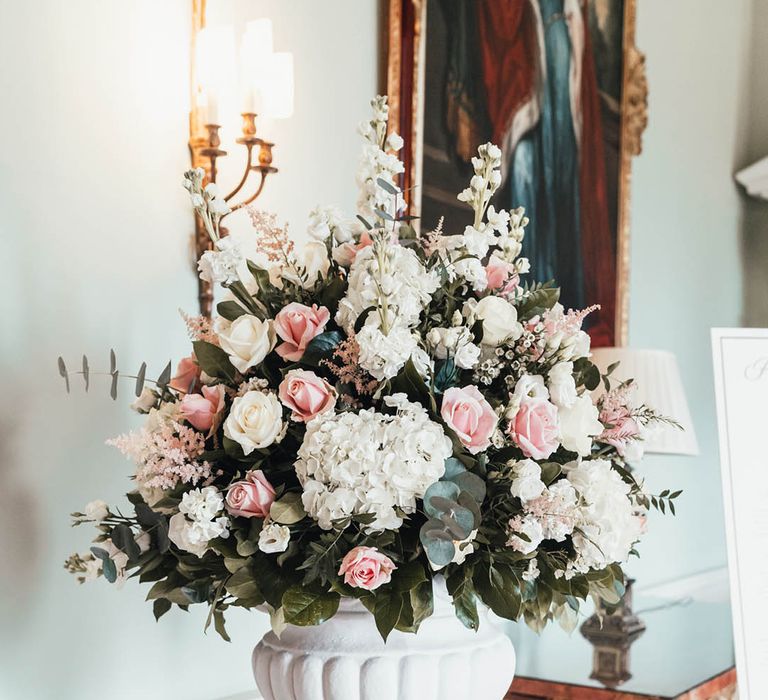 Pink roses with white roses, hydrangeas and stock wedding flower decoration 