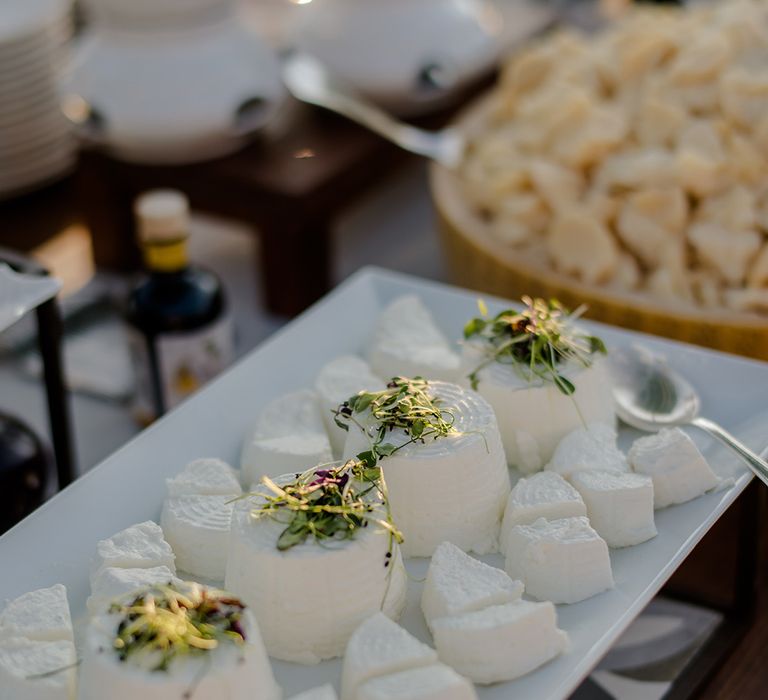 Food on white plate for outdoor wedding reception in Tuscany 