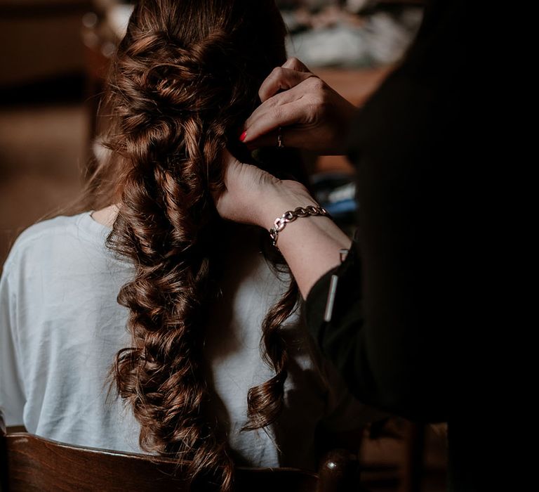 pinned fishtail wedding hairstyle 