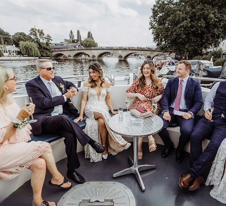 Bride and the wedding guests get to enjoy cocktail hour on a boat ride 