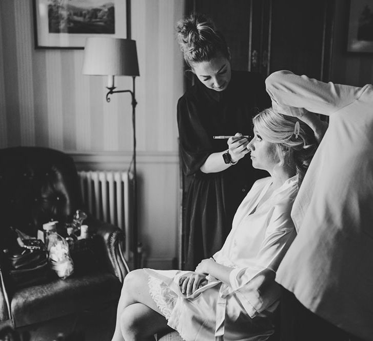 Bride has her hair and makeup done on the morning of her wedding day