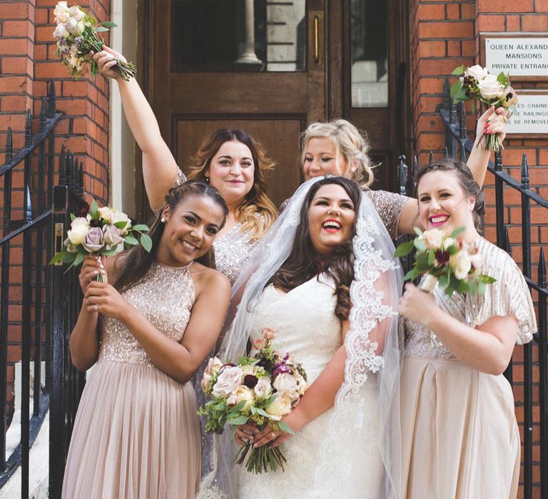 Champagne gold sequin bridesmaid dresses with the bride in a lace wedding dress