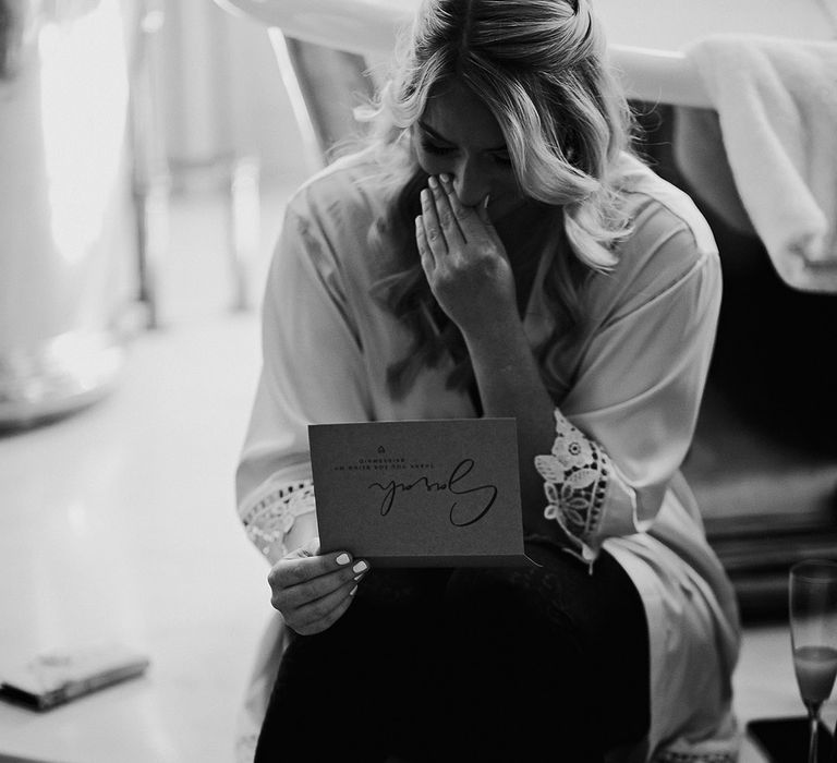 Bridesmaids reads a personal letter from the bride with gifts on the morning of the wedding 