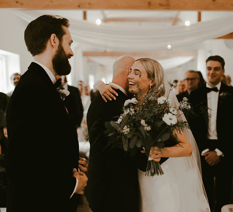 Father of the bride has the bride after walking her down the aisle for the couple to have a personal ceremony 