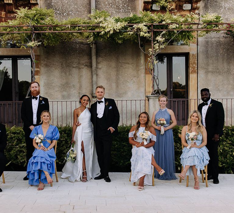 wedding party photography for black tie wedding with tuxedos and blue bridesmaid dresses