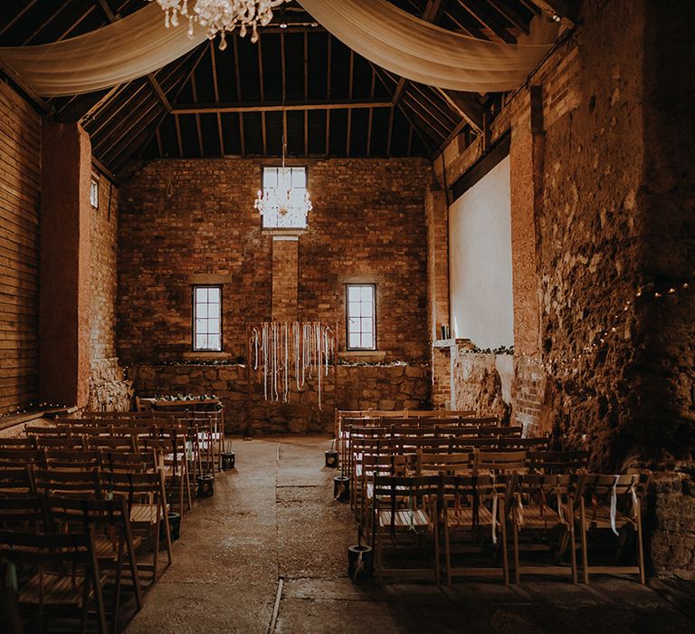 Exmouth Country Lodge wedding venue decorated with white drapery, fairy lights and DIY ribbon altar decoration for rustic romance theme wedding 