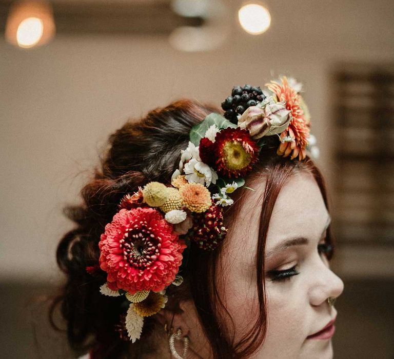 Bride in contemporary up-do bridal hairstyle with boho rustic dried flower crown 