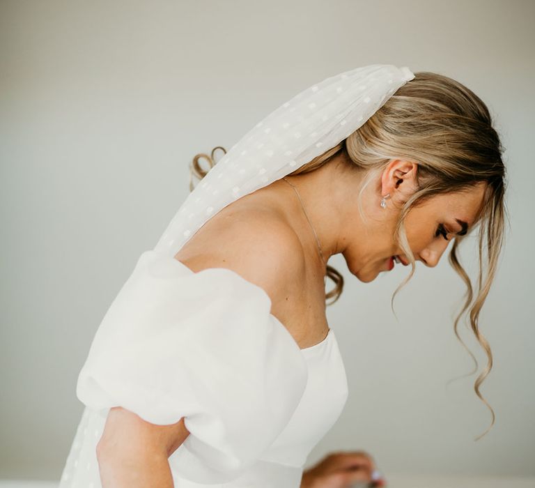 Bride in Jesus Peiro puff sleeve off the shoulder wedding dress with dotted wedding veil 