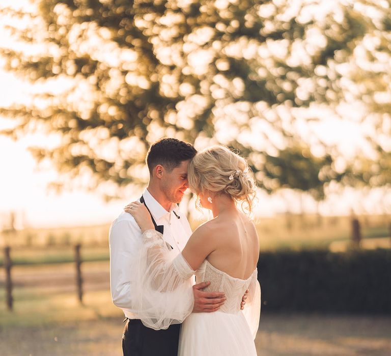 Romatic bride and groom golden hour photo at Banbury wedding