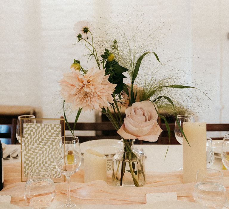 Pale pink wedding flowers on wedding tablescape for neutral theme 