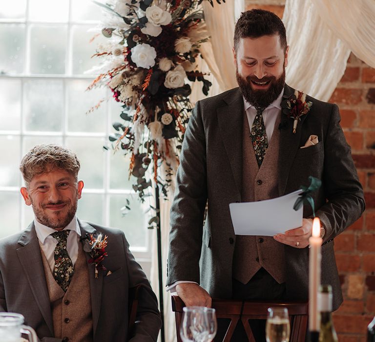 Groom reads wedding speech at the wedding breakfast 