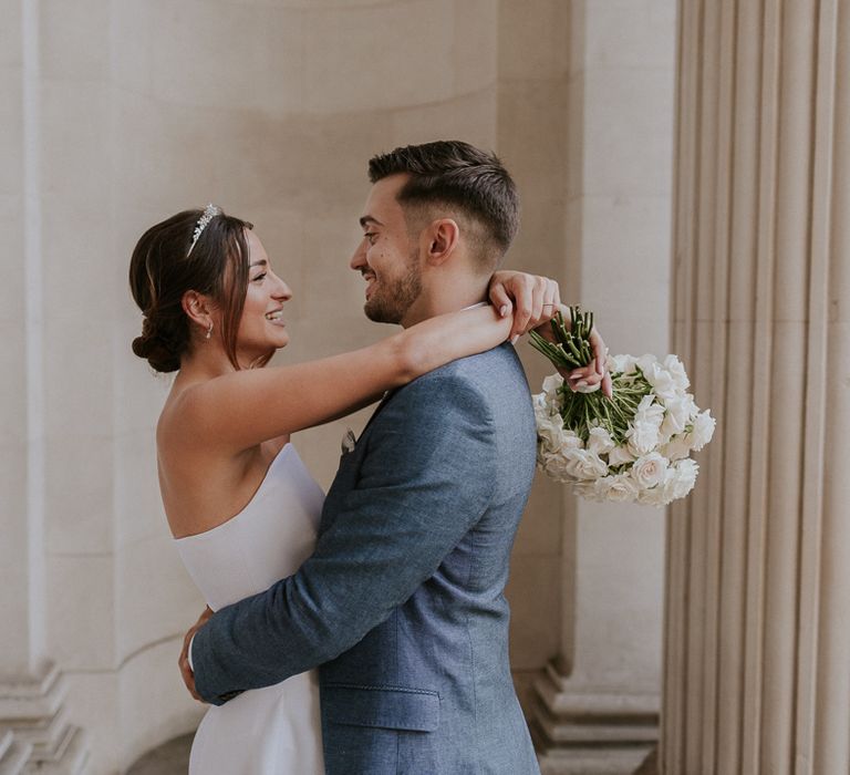 Bride and groom embracing at Old Marylebone Town Hall Wedding 