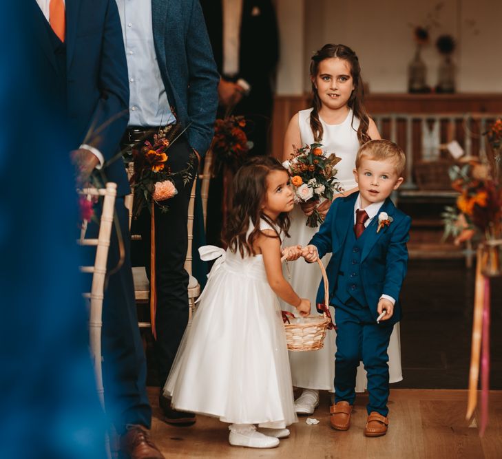 Flower girls and page boys laying petals at Millbridge Court wedding 