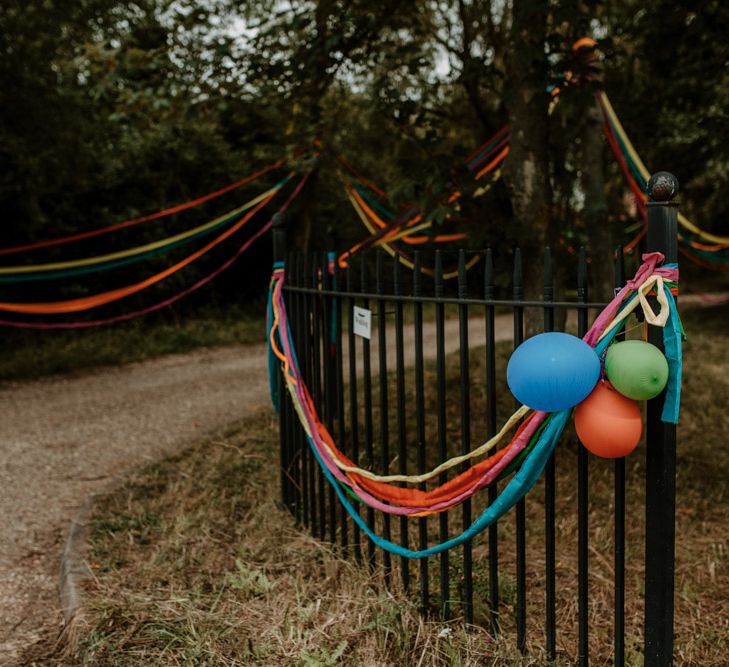 rainbow wedding decor streamers and balloons