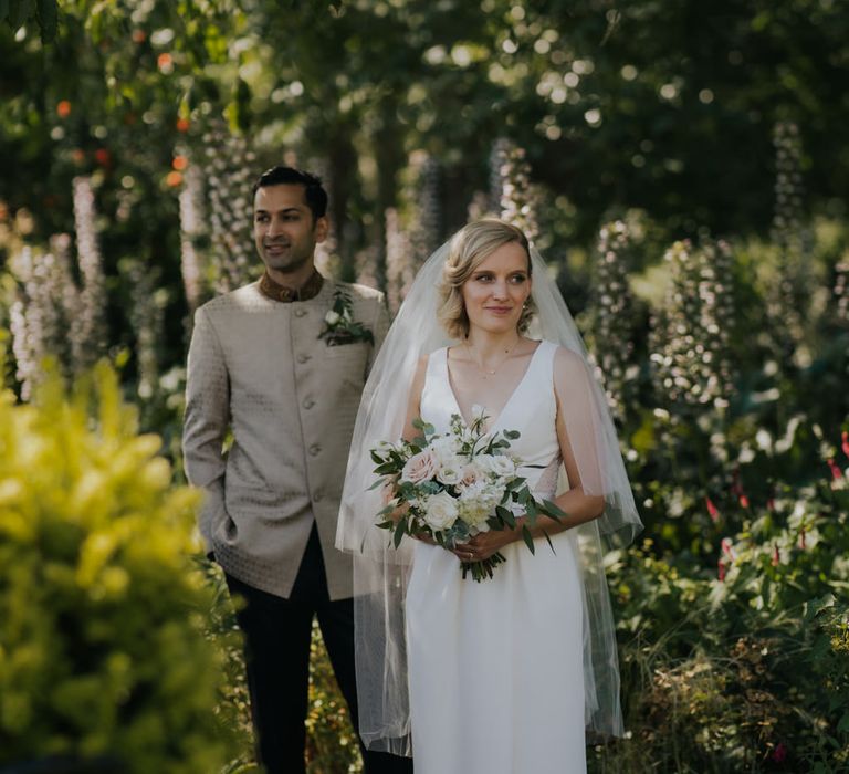 Bride and groom portrait in the gardens 