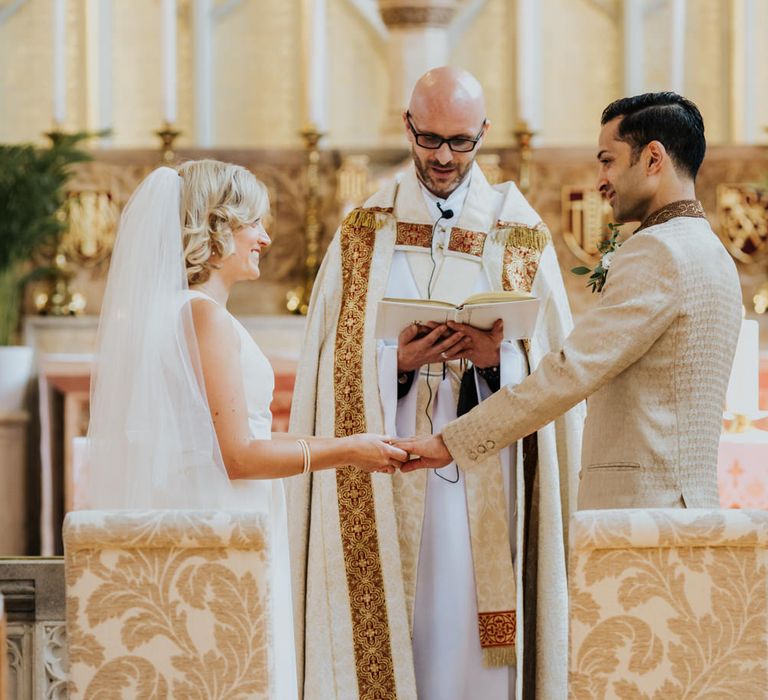 Bride and groom exchanging vows at church micro wedding 