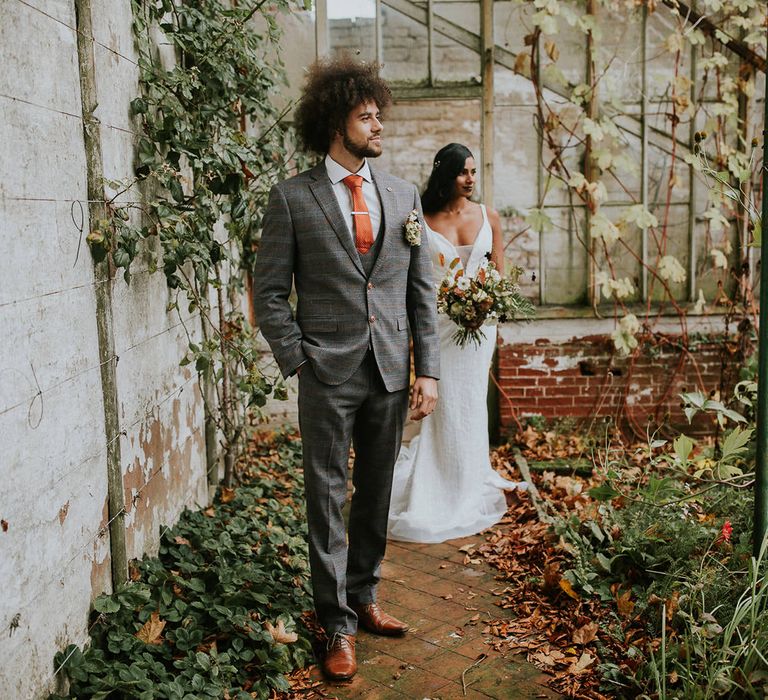 bride and groom portrait in the conservatory at Hooton Pagnell Hall 