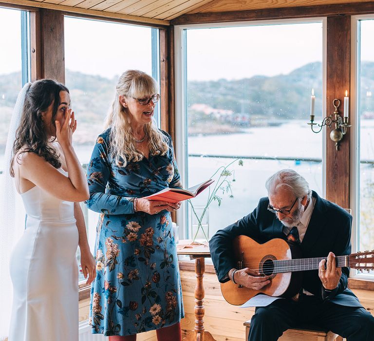 An intimate family led blessing ceremony with music and singing