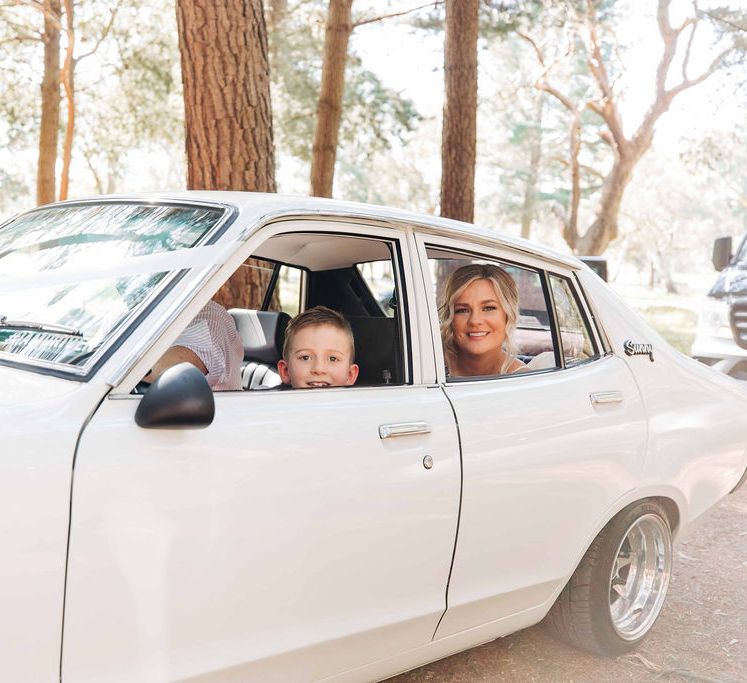 White vintage wedding car for bride and groom