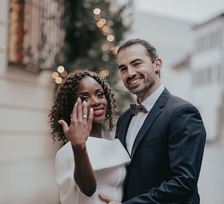 Bride shows her wedding ring to the camera