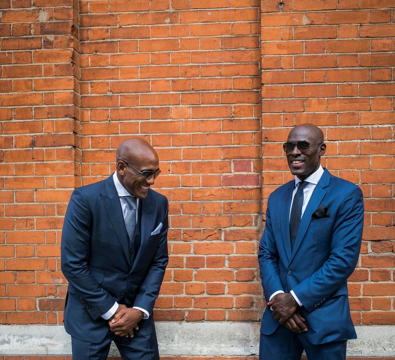 Groom and best man in navy suits at intimate Town Hall wedding 