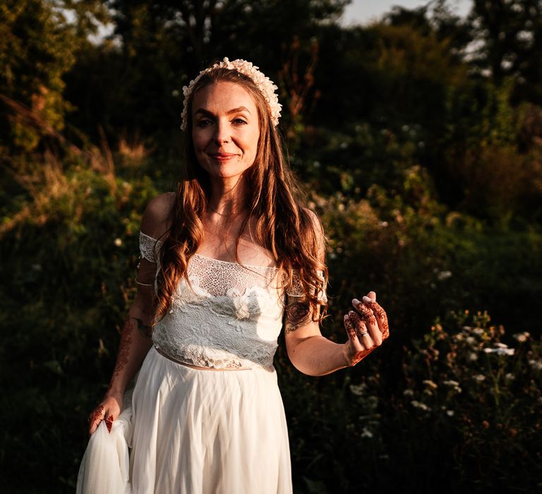 Bride wears white two-piece bridal dress 